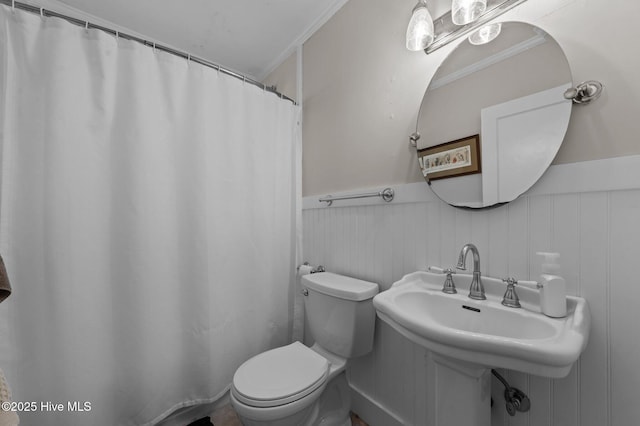 410 Craven St, Bath, NC 27808 - full bathroom with toilet, a wainscoted wall, ornamental molding, and a shower with curtain
