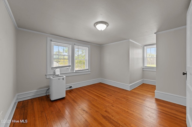 410 Craven St, Bath, NC 27808 - spare room featuring hardwood / wood-style floors, crown molding, healthy amount of natural light, and baseboards