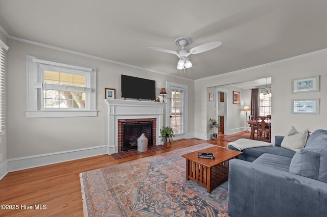 410 Craven St, Bath, NC 27808 - living room with ornamental molding, ceiling fan, wood finished floors, plenty of natural light, and baseboards