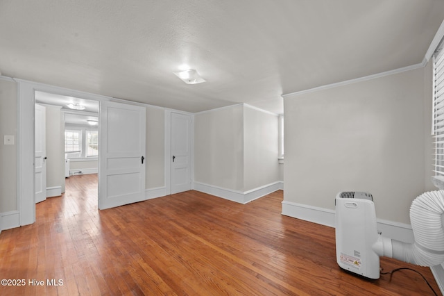 410 Craven St, Bath, NC 27808 - spare room featuring light wood-type flooring, baseboards, and crown molding