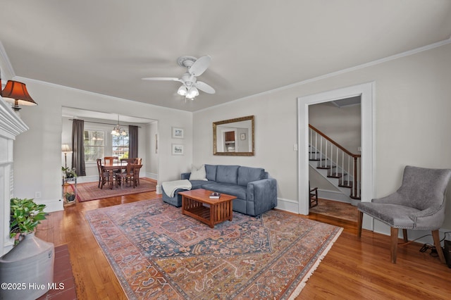 410 Craven St, Bath, NC 27808 - living room featuring stairway, wood finished floors, crown molding, ceiling fan, and baseboards