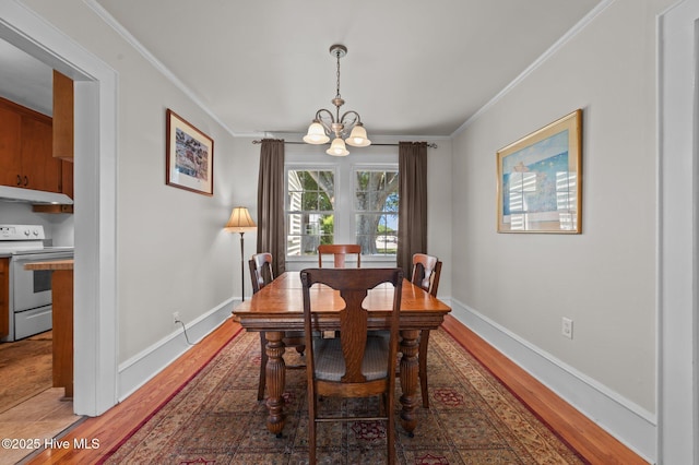 410 Craven St, Bath, NC 27808 - dining area featuring a chandelier, ornamental molding, light wood-style floors, and baseboards
