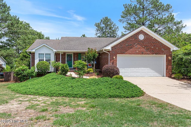 2 Beryl Cir, Pinehurst, NC 28374 - view of front of house featuring brick siding, an attached garage, driveway, and a front lawn