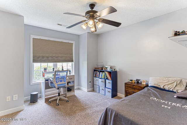 2 Beryl Cir, Pinehurst, NC 28374 - carpeted bedroom with baseboards, a ceiling fan, and a textured ceiling