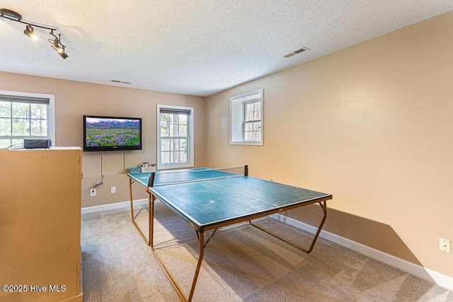 2 Beryl Cir, Pinehurst, NC 28374 - recreation room featuring carpet floors, baseboards, a textured ceiling, and track lighting