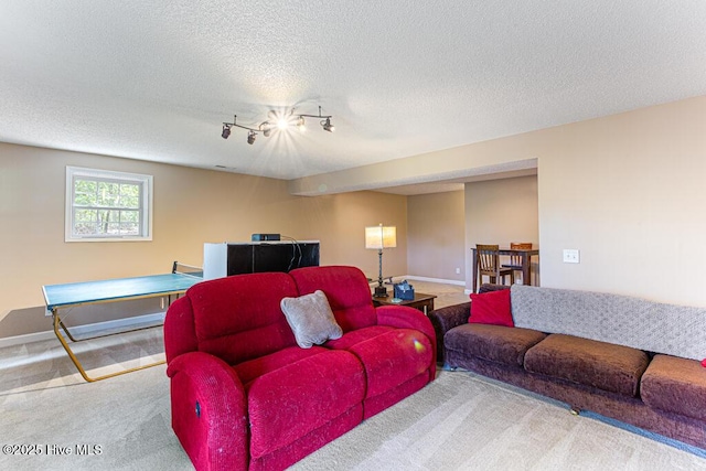 2 Beryl Cir, Pinehurst, NC 28374 - living room with carpet floors, baseboards, rail lighting, and a textured ceiling
