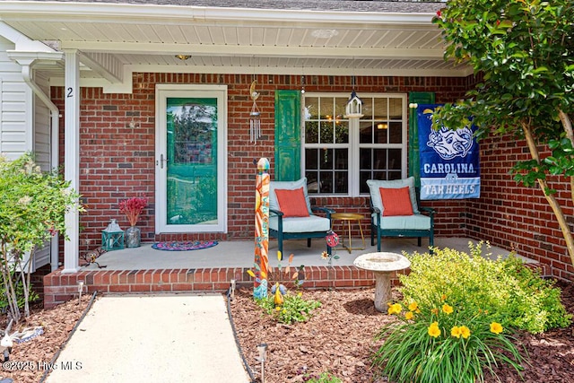 2 Beryl Cir, Pinehurst, NC 28374 - view of exterior entry with a porch and brick siding
