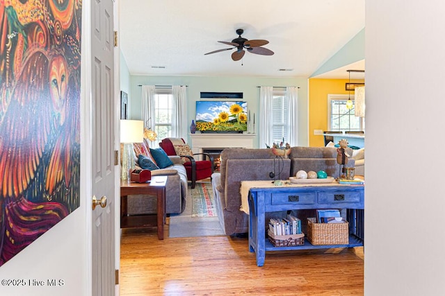 2 Beryl Cir, Pinehurst, NC 28374 - living area featuring ceiling fan, plenty of natural light, wood finished floors, and vaulted ceiling
