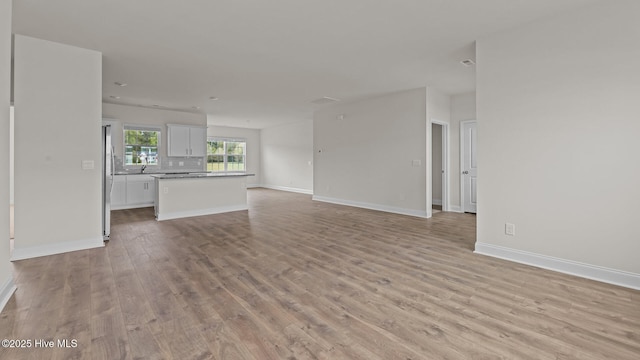 205 Lake Tyler Dr, New Bern, NC 28560 - unfurnished living room featuring light wood-type flooring and baseboards