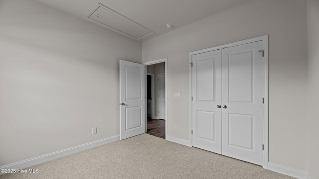 205 Lake Tyler Dr, New Bern, NC 28560 - unfurnished bedroom featuring attic access, carpet flooring, baseboards, and a closet