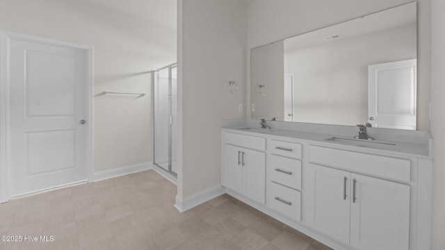 205 Lake Tyler Dr, New Bern, NC 28560 - full bath with a stall shower, tile patterned floors, double vanity, and baseboards