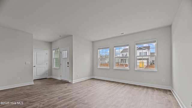 205 Lake Tyler Dr, New Bern, NC 28560 - unfurnished living room featuring wood finished floors and baseboards