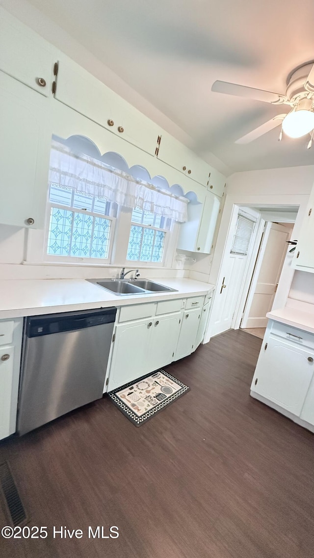 308 Terry St, Hamlet, NC 28345 - kitchen featuring dishwasher, a sink, white cabinetry, and light countertops