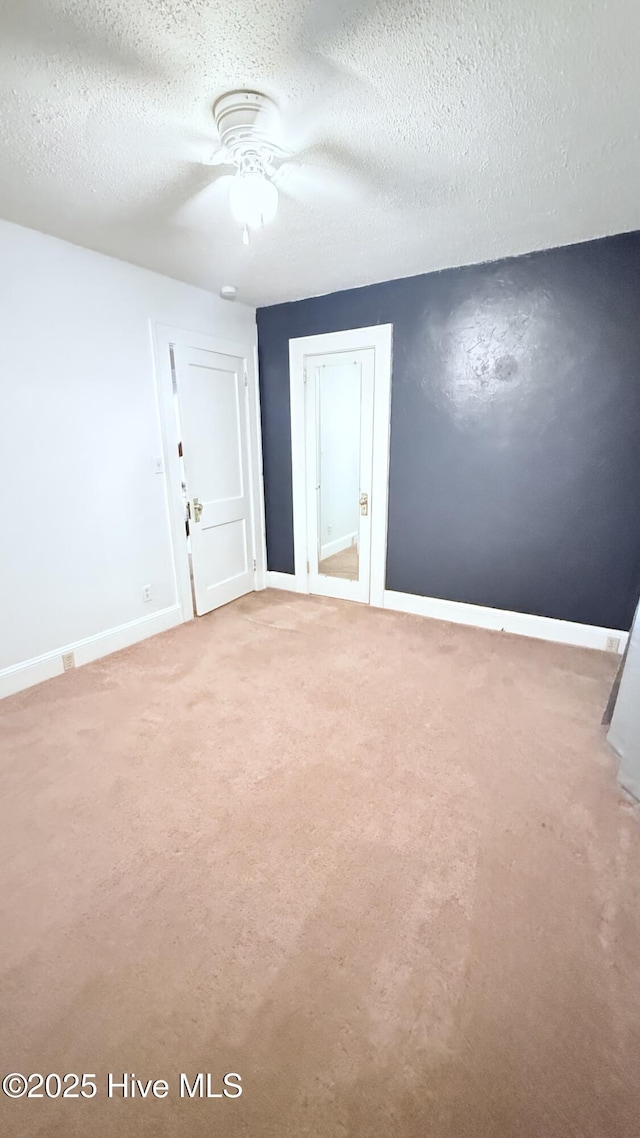 308 Terry St, Hamlet, NC 28345 - carpeted empty room with baseboards, ceiling fan, and a textured ceiling