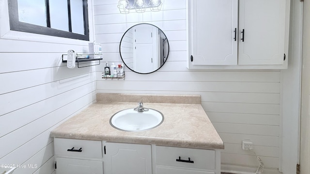 308 Terry St, Hamlet, NC 28345 - bathroom with vanity and wooden walls