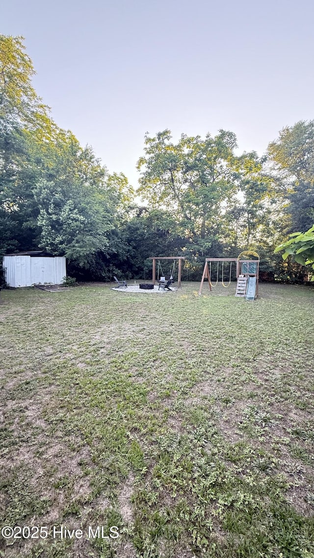 308 Terry St, Hamlet, NC 28345 - view of grassy yard with a playground