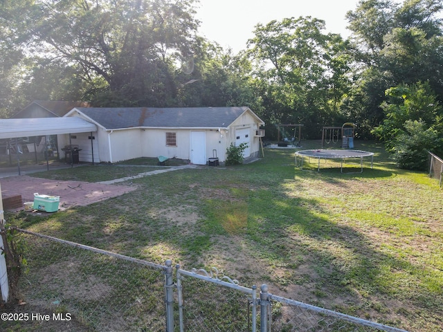 308 Terry St, Hamlet, NC 28345 - view of front of home featuring a gate, a playground, and a trampoline