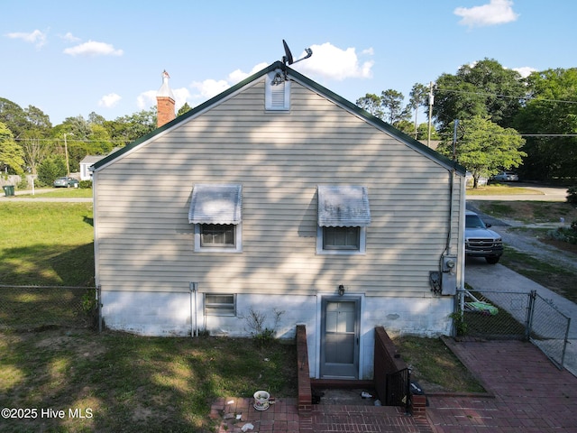 308 Terry St, Hamlet, NC 28345 - back of house featuring a chimney