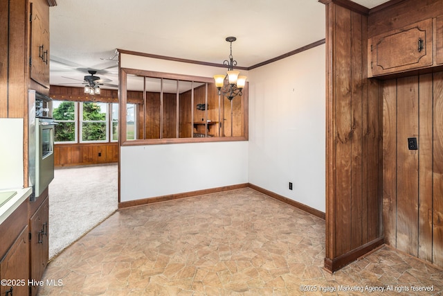 1363 Robert Everett Rd, Robersonville, NC 27871 - spare room with light stone finish flooring, baseboards, a ceiling fan, a chandelier, and wood walls
