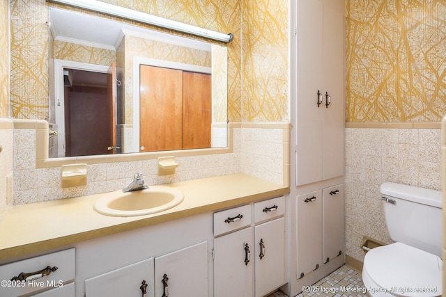 1363 Robert Everett Rd, Robersonville, NC 27871 - half bath featuring wallpapered walls, toilet, crown molding, vanity, and tile walls