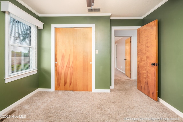 1363 Robert Everett Rd, Robersonville, NC 27871 - unfurnished bedroom with carpet, ornamental molding, baseboards, and a closet