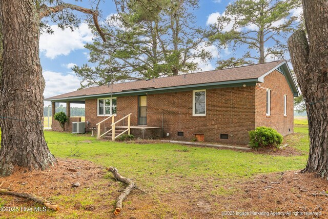 1363 Robert Everett Rd, Robersonville, NC 27871 - rear view of house featuring crawl space, brick siding, a lawn, and central air condition unit
