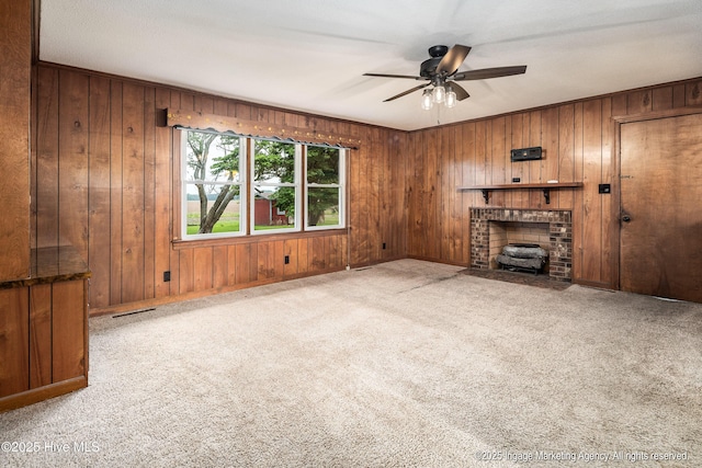 1363 Robert Everett Rd, Robersonville, NC 27871 - unfurnished living room featuring a ceiling fan, wood walls, and carpet floors