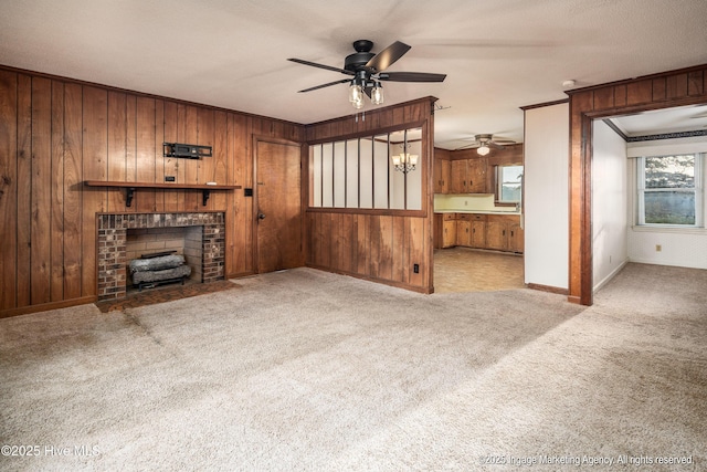 1363 Robert Everett Rd, Robersonville, NC 27871 - unfurnished living room with a ceiling fan, carpet flooring, wooden walls, ornamental molding, and baseboards