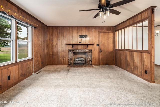 1363 Robert Everett Rd, Robersonville, NC 27871 - unfurnished living room with wood walls, carpet floors, ceiling fan, and baseboards