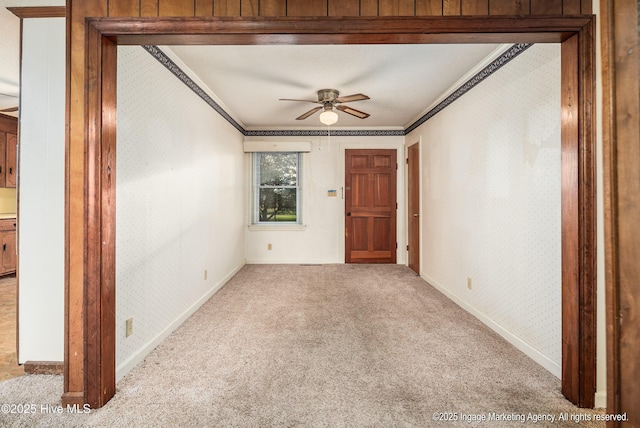 1363 Robert Everett Rd, Robersonville, NC 27871 - carpeted empty room featuring ornamental molding, wallpapered walls, ceiling fan, and baseboards