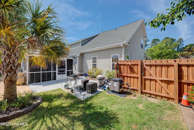 4029 Berberis Way, Wilmington, NC 28412 - back of property with a patio, a shingled roof, a sunroom, and a gate