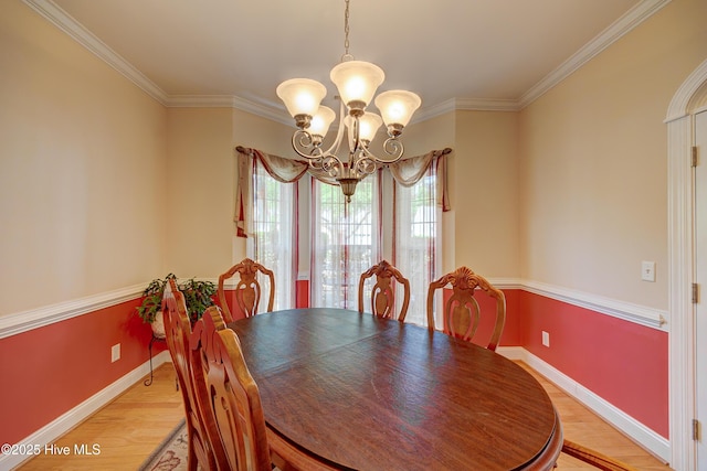 4029 Berberis Way, Wilmington, NC 28412 - dining area with a chandelier, light wood finished floors, crown molding, and baseboards