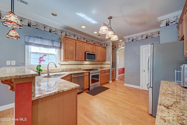 4029 Berberis Way, Wilmington, NC 28412 - kitchen featuring a sink, stainless steel appliances, light stone countertops, crown molding, and tasteful backsplash