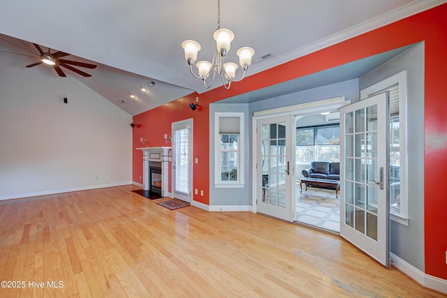 4029 Berberis Way, Wilmington, NC 28412 - unfurnished living room featuring french doors, light wood finished floors, a ceiling fan, a chandelier, and baseboards