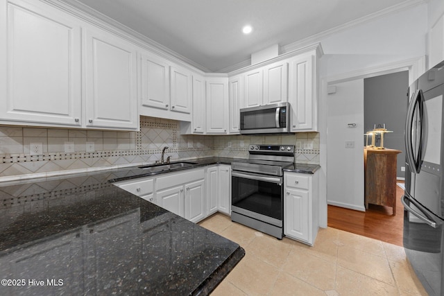 3 Merion Cir, Pinehurst, NC 28374 - kitchen featuring appliances with stainless steel finishes, a sink, white cabinets, recessed lighting, and crown molding