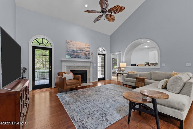 3 Merion Cir, Pinehurst, NC 28374 - living area featuring high vaulted ceiling, ceiling fan, a tiled fireplace, and wood finished floors