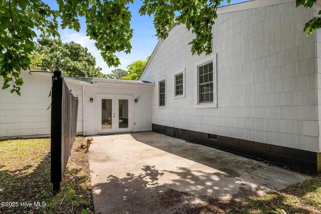 306 Oak Dr, Tarboro, NC 27886 - rear view of property featuring crawl space, french doors, and a patio