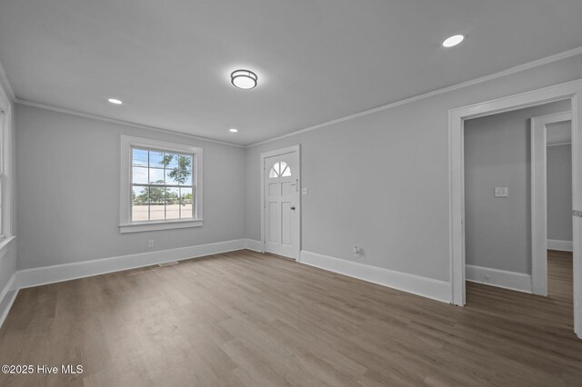 306 Oak Dr, Tarboro, NC 27886 - entrance foyer with ornamental molding, wood finished floors, baseboards, and recessed lighting