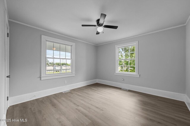 306 Oak Dr, Tarboro, NC 27886 - unfurnished room featuring crown molding, baseboards, wood finished floors, and ceiling fan