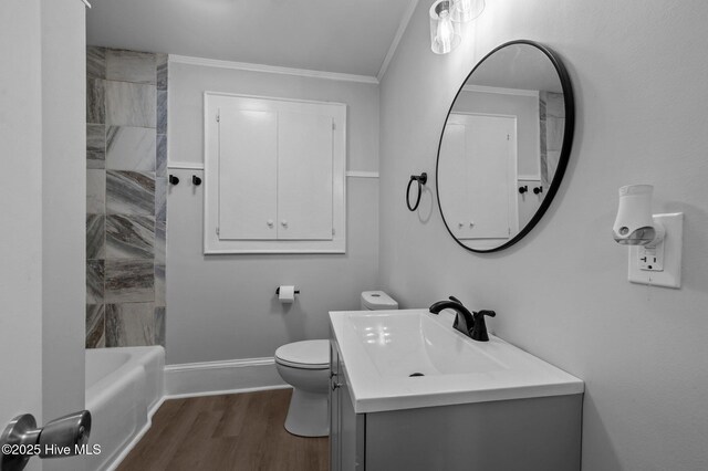 306 Oak Dr, Tarboro, NC 27886 - bathroom with ornamental molding, vanity, wood finished floors, toilet, and shower / bathtub combination