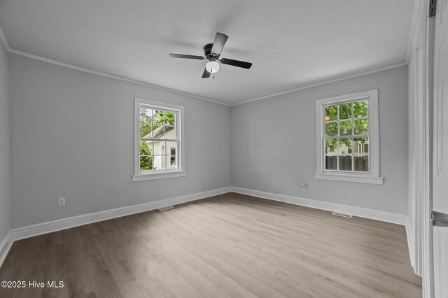 306 Oak Dr, Tarboro, NC 27886 - spare room with crown molding, healthy amount of natural light, wood finished floors, and baseboards