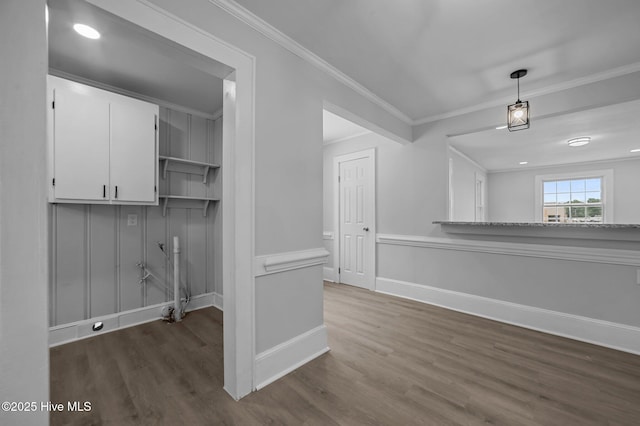 306 Oak Dr, Tarboro, NC 27886 - unfurnished dining area featuring dark wood-style flooring, ornamental molding, and baseboards