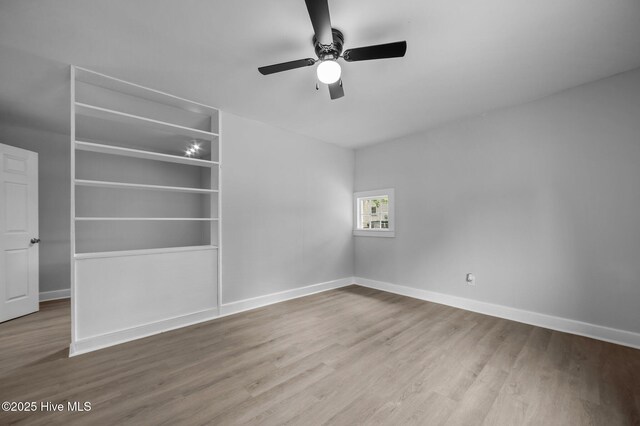 306 Oak Dr, Tarboro, NC 27886 - unfurnished room with wood finished floors, baseboards, and ceiling fan
