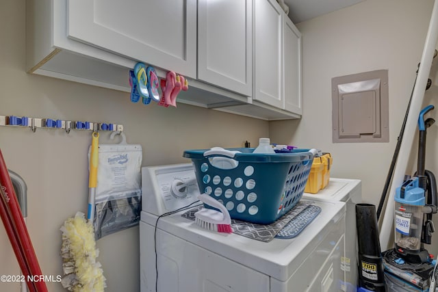 316 Bay Cir, North Topsail Beach, NC 28460 - laundry room with independent washer and dryer, cabinet space, and electric panel