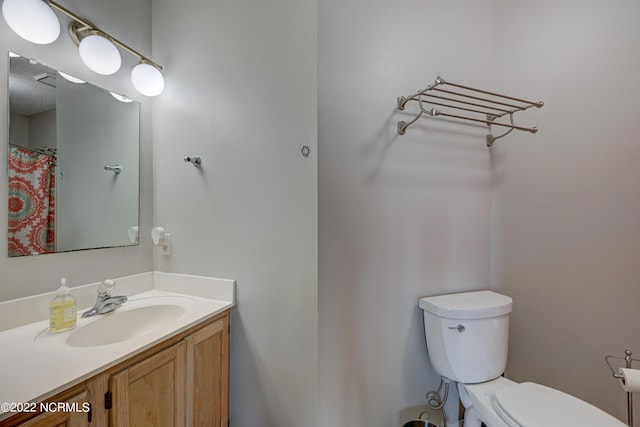 316 Bay Cir, North Topsail Beach, NC 28460 - bathroom with toilet and vanity