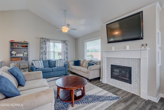 316 Bay Cir, North Topsail Beach, NC 28460 - living area featuring wood finished floors, lofted ceiling, a ceiling fan, and a fireplace