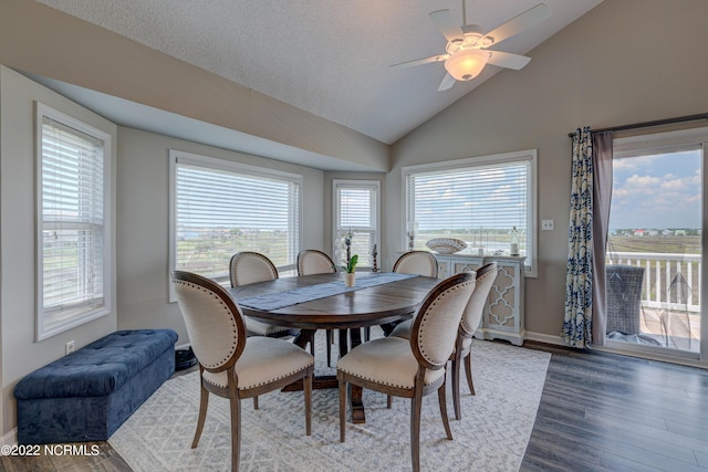 316 Bay Cir, North Topsail Beach, NC 28460 - dining room with vaulted ceiling, wood finished floors, a ceiling fan, and baseboards