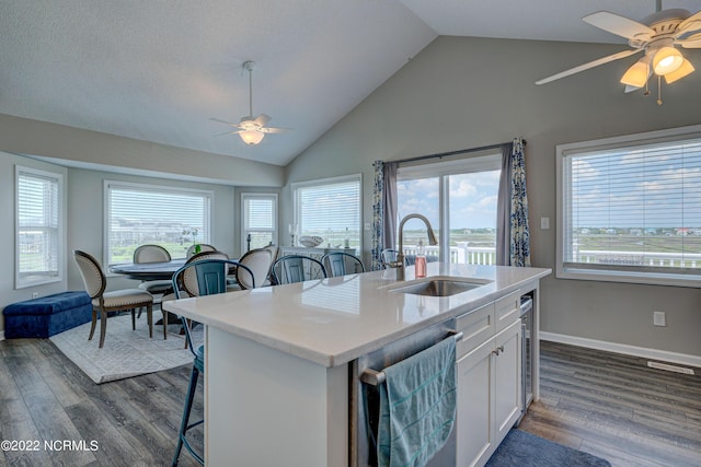 316 Bay Cir, North Topsail Beach, NC 28460 - kitchen featuring a sink, a ceiling fan, dishwasher, white cabinetry, and dark wood-type flooring