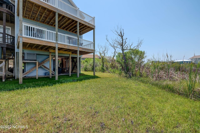 316 Bay Cir, North Topsail Beach, NC 28460 - view of green lawn with a deck