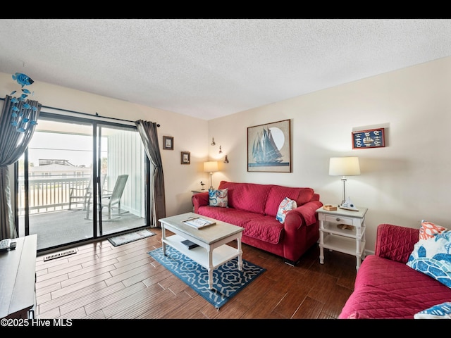 1013 Carolina Beach Ave N Unit 1F, Carolina Beach, NC 28428 - living room featuring wood finish floors and a textured ceiling